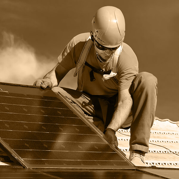 A man installing solar panel on display